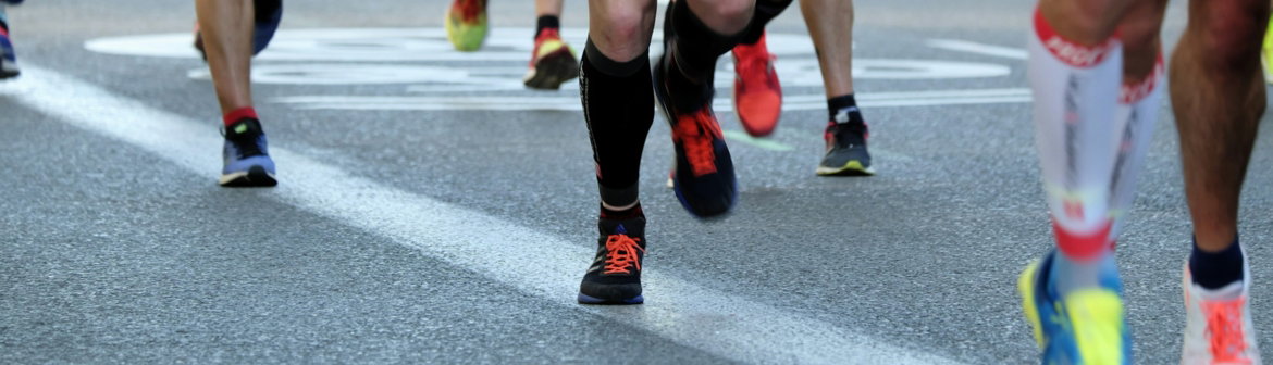 people-running-on-gray-asphalt-road-during-daytime.jpg people running on gray asphalt road during daytime